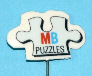 MB MILTON BRADLEY PUZZLES COLLECTORS PIN BADGE 1980s SPEELBOOM TOY STORE PROMO