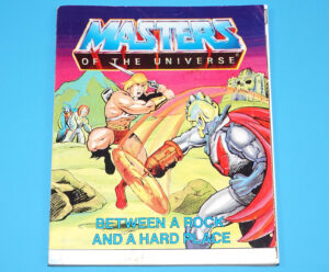 MOTU HE-MAN MASTERS OF THE UNIVERSE MINI COMIC BETWEEN A ROCK AND A HARD PLACE MULTI MALAYSIA 1985 MATTEL READ