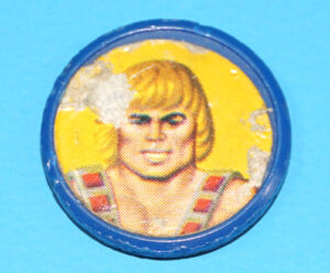 MOTU HE-MAN MASTERS OF THE UNIVERSE ORIGINAL SPARE PART ORKO COIN HE-MAN HONG KONG 1984 MATTEL